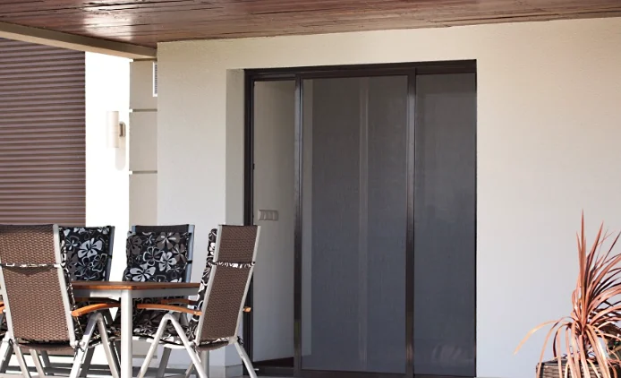 Modern residential window with sleek insect screen mesh installed